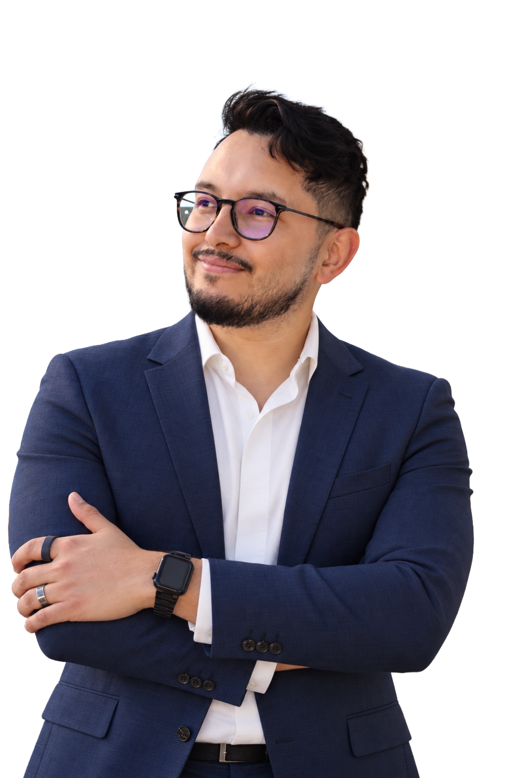 Josue Arana in a navy suit with his arms crossed, looking toward the left